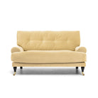 Blanca Love Seat Creme är en liten Howard-soffa i ljusgul sammet från Melimeli